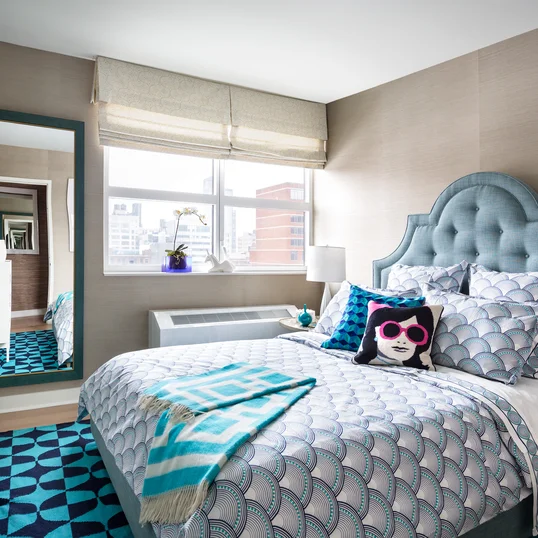 Top design firm Clodagh designed spacious model bedrooms with calming earth tones.