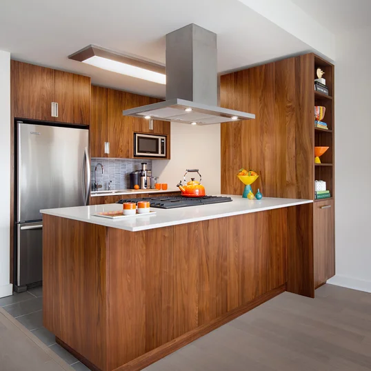 Gourmet kitchens include walnut cabinetry, Caesarstone countertops, and stainless steel KitchenAid® appliances.