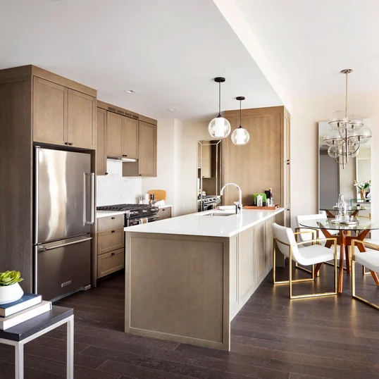 Top-of-the-line appliance suite featuring stainless steel refrigerator, gas range with oven, microwave in custom millwork pantry and integrated dishwasher.