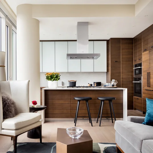 Custom kitchen cabinetry with matte black hardware, Turkish marble countertop and backsplash designed by Andre Kikoski Architect.