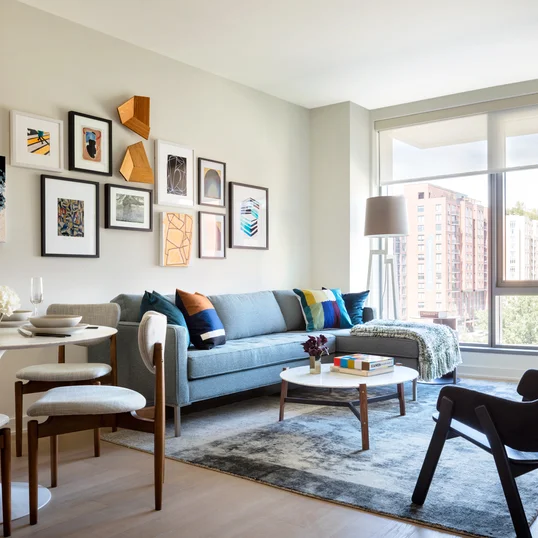 Large windows offer light-filled living with spectacular city views