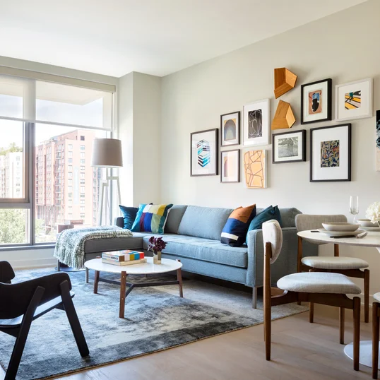 Large windows offer light-filled living with spectacular city views