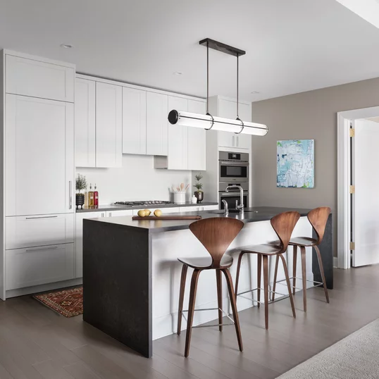 Kitchens feature Subzero built-in refrigerator, bottom mount freezer, Bosch Benchmark appliances including electric oven, gas cooktop, integrated dishwasher and microwave drawer.