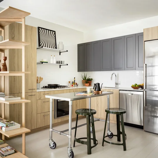 Modern kitchens include Bosch appliances, refined subway tile backsplash, quartz  countertops, stainless steel shelving, and stainless steel single bowl sink.