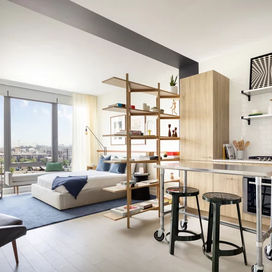 Spacious living rooms have nine-foot ceilings with floor-to-ceiling windows. 