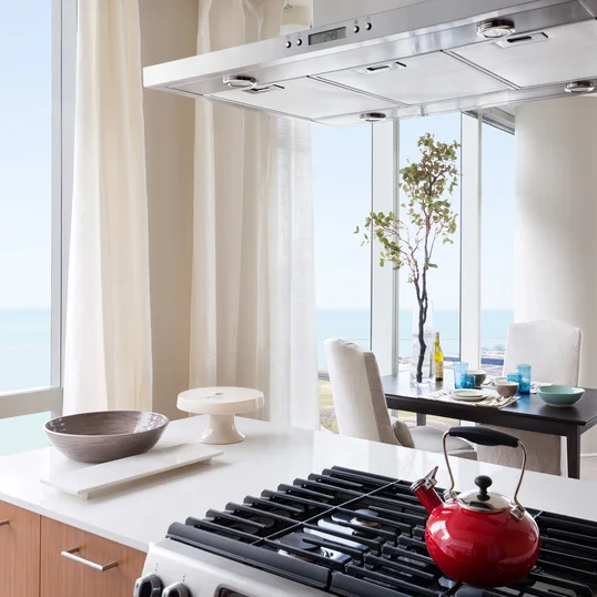 Gourmet kitchens with Snaidero duotone cabinetry and quartz countertops