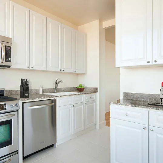 Layouts feature gourmet kitchens with paneled white cabinet doors, stainless steel appliances and granite counters.