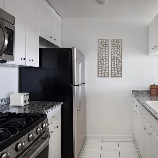 The gourmet kitchens at Tribeca Park include GE appliances and granite countertops.