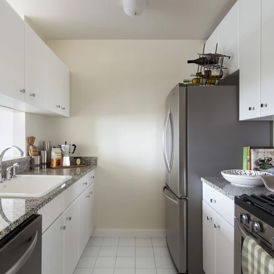 Gourmet stone kitchens feature stainless steel appliances and Euro-style cabinetry.
