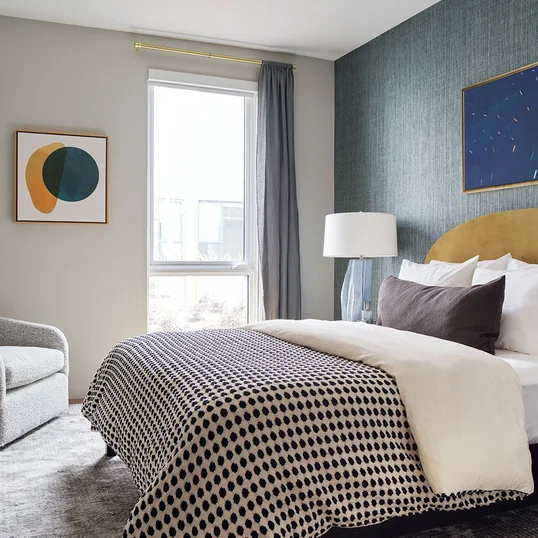 Bedrooms feature wide-plank flooring throughout and spacious closets with Elfa shelving systems.