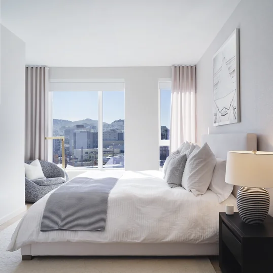 Spacious bedrooms feature blackout shades and a customizable Elfa closet-shelving system.