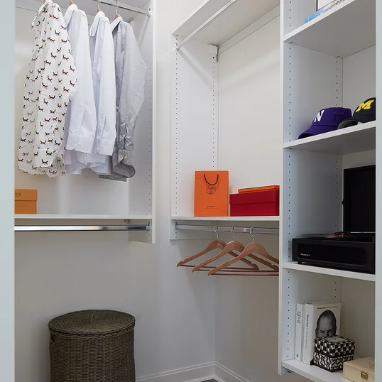 Large walk-in closets with custom shelving.