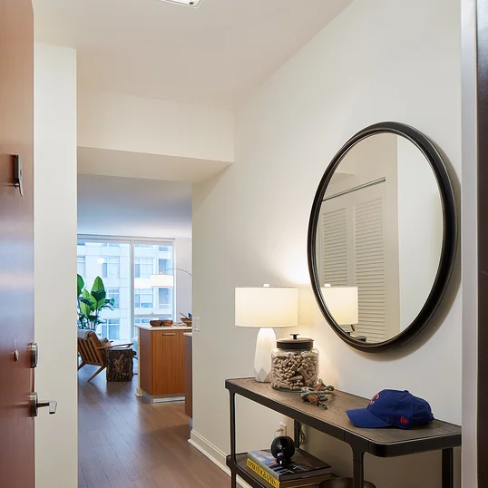 Custom-designed wide-plank wood flooring throughout residences.