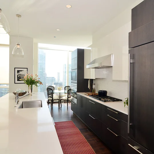 Gourmet kitchens with Snaidero duotone cabinetry and quartz countertops