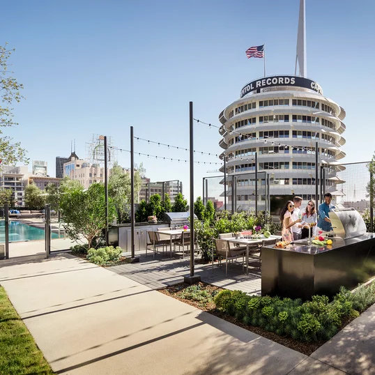 Lushly landscaped terrace complete with an outdoor pool, spa, BBQ grills, and pet spa