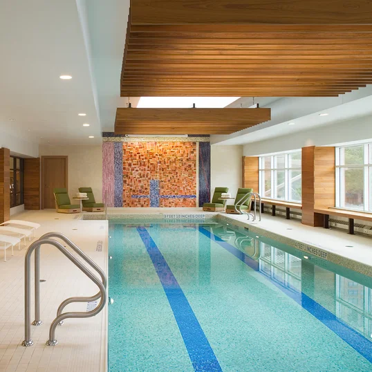 A heated swimming pool flooded with natural light, adjacent to a state-of-the-art health and fitness center, will inspire you to meet your fitness goals.