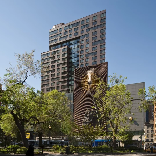 Facade features mixed-media art piece, The Metronome