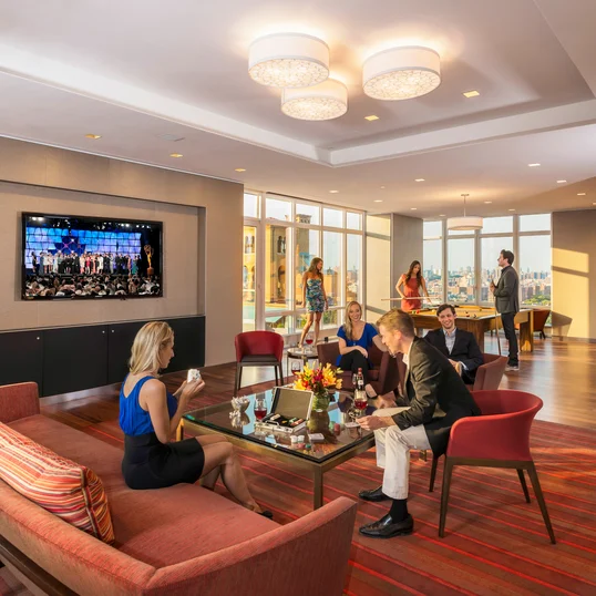 Located on the 20th floor with breathtaking Central Park views, the entertainment lounge features a 20-by-60 foot sitting area, billiards, a walnut paneled bar, and Venato Travertine hearth.