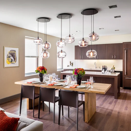 Relax and socialize with friends in an intimate club setting with a large screen TV, open kitchen and lots of comfy chairs.