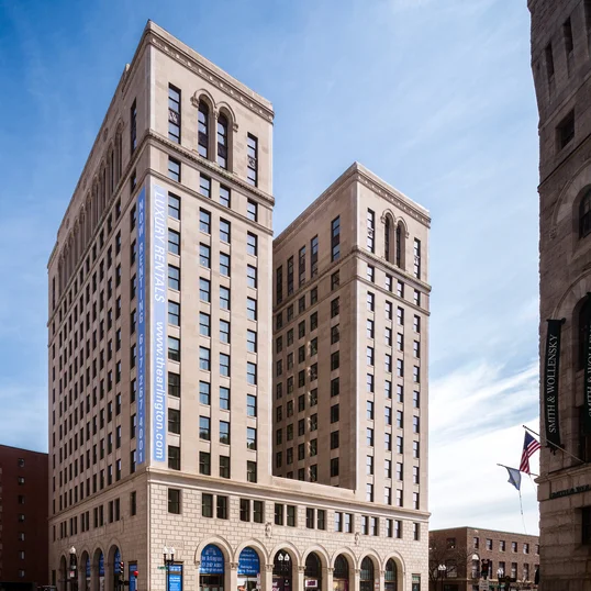 Historic building, with original details, including arched windows and ornate columns throughout the property.