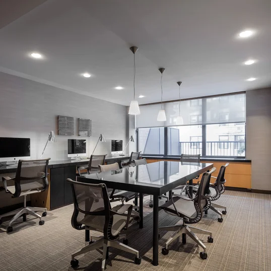 A fully furnished and wired conference room, large enough to comfortably seat eight people, is available for residents' use.