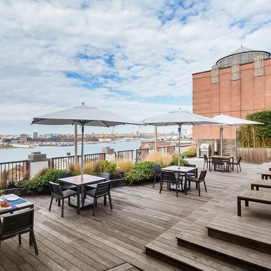The landscaped rooftop sun terrace provides a perfect setting for enjoying gorgeous views of the city and the Hudson River.
