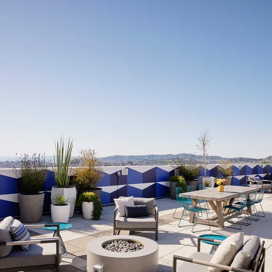 The lushly landscaped sun terrace is furnished with lounge chairs and shaded cabanas.