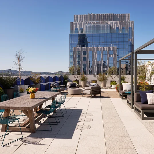 The lushly landscaped sun terrace is furnished with lounge chairs and shaded cabanas.