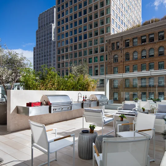 Take in breathtaking sunsets and city views from the rooftop BBQ terrace.