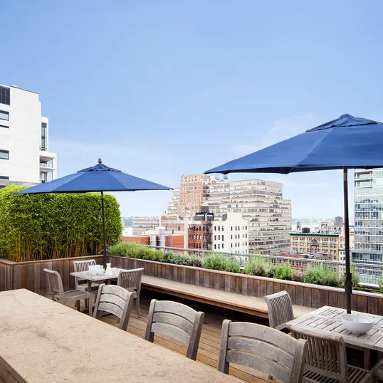 Perfectly planned landscaping on the rooftop terrace offers the ideal location to take in sweeping views of the Hudson River.