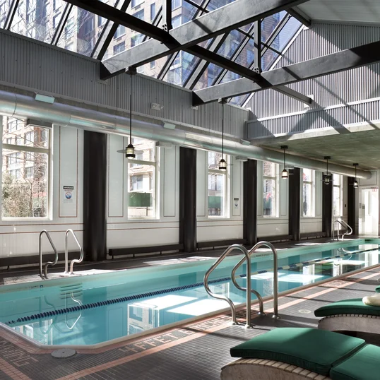 A skylit sixty foot heated swimming pool is adjacent to a state-of-the art health and fitness center. 