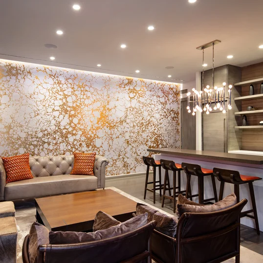 Socialize in a stunning lounge featuring lots of natural light, a large screen TV, open kitchen, sofas and tables for dining, conversation and games. The lounge is adjacent to the dining terrace.