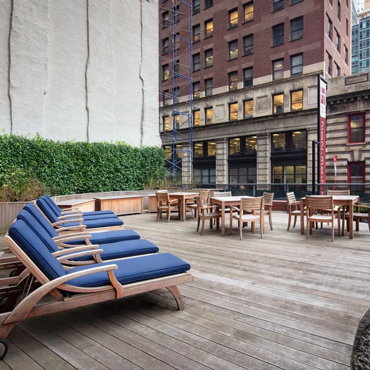 This lushly landscaped sun terrace complete with lounge chairs, tables and chairs provides the perfect setting to relax, refresh and recharge while enjoying views of the city.