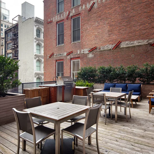 This lushly landscaped sun terrace complete with lounge chairs, tables and chairs provides the perfect setting to relax, refresh and recharge while enjoying views of the city.