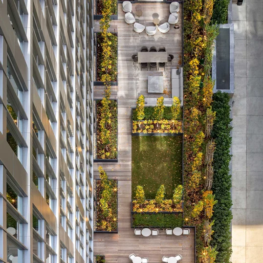 Landscaped courtyard with lounge area and fireplace
