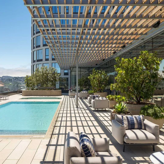 Swim, sunbathe, and socialize with the cityscape and bay as your backdrop on the rooftop pool and sun deck, which also features a hot tub, barbecues, heat lamps and access to the Pool House. 