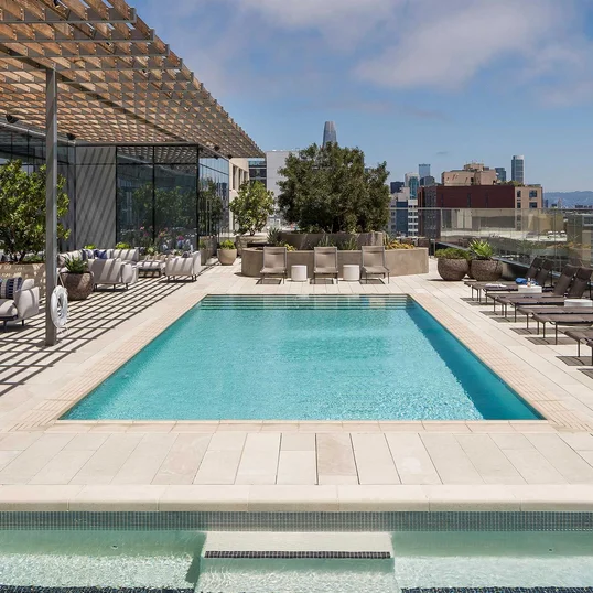 Swim, sunbathe, and socialize with the cityscape and bay as your backdrop on the rooftop pool and sun deck, which also features a hot tub, barbecues, heat lamps and access to the Pool House. 