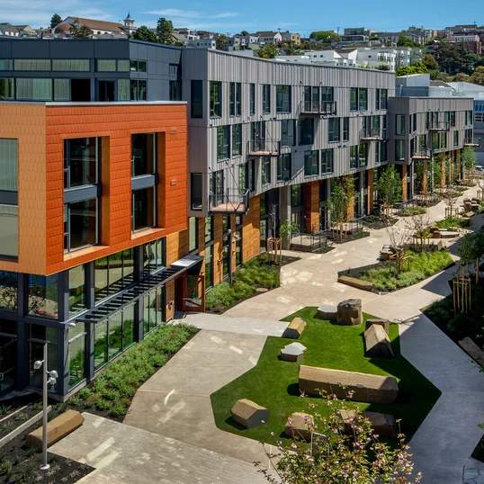 Landscaped courtyards with outdoor grills and dining