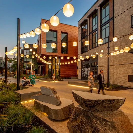Landscaped courtyards with outdoor grills and dining