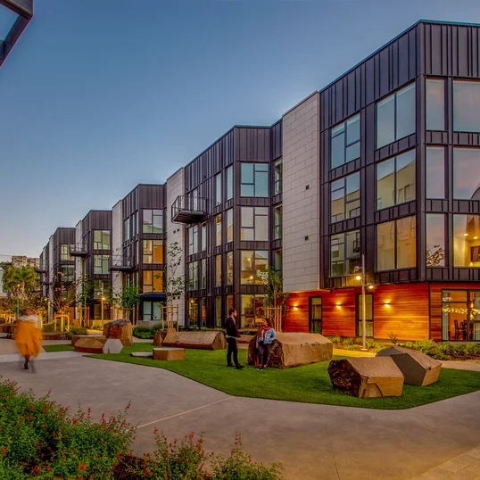 Landscaped courtyards with outdoor grills and dining