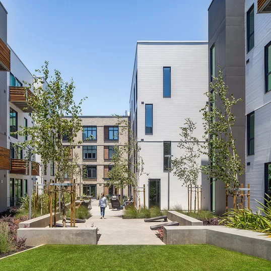 Landscaped courtyards with outdoor grills and dining
