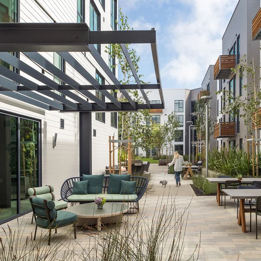 Landscaped courtyards with outdoor grills and dining