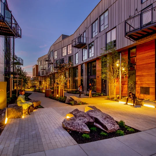 Landscaped courtyards with outdoor grills and dining