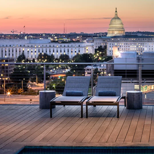 Landscaped rooftop with gunite swimming pool, two hot tubs, and resort-style sun terrace.