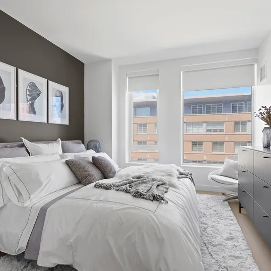 Spacious and comfortable primary bedroom with large closet space