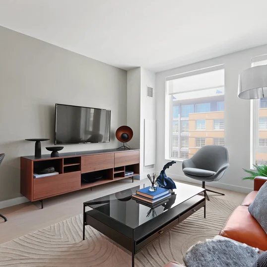 Gracious living space with hardwood floors and custom built-ins