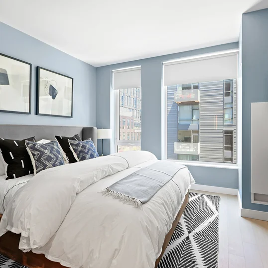 Spacious and comfortable primary bedroom with large closet space