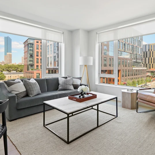 Gracious living space with hardwood floors and custom built-ins
