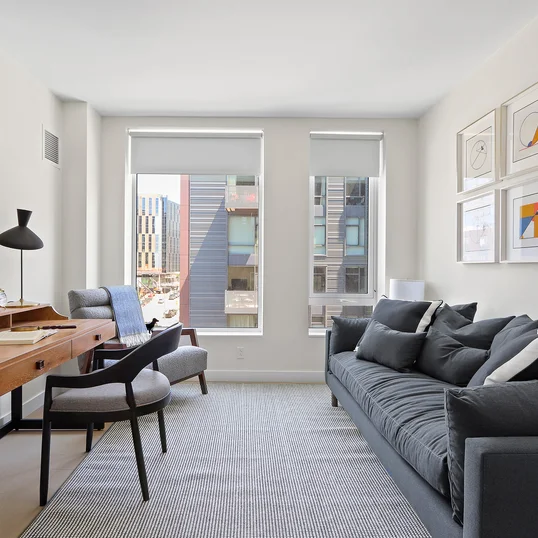 Gracious living space with hardwood floors and custom built-ins
