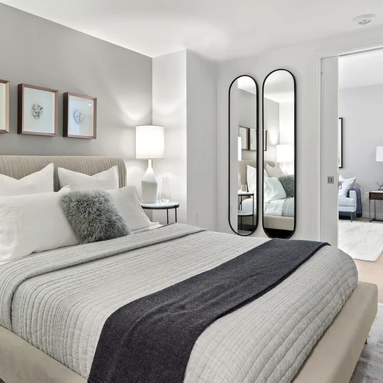 Spacious and comfortable primary bedroom with large closet space